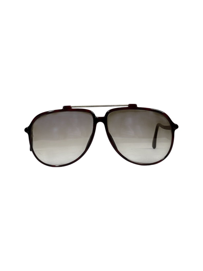 Sunglasses with reflective lenses on a white background