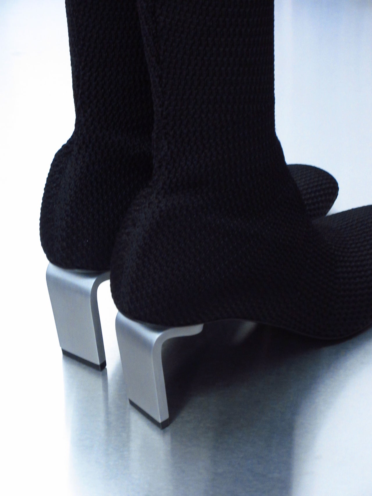 Jil Sander sock-style high heels on a white background