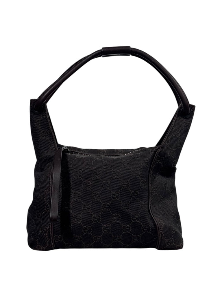 Browngucci canvashandbag with a pattern on a white background