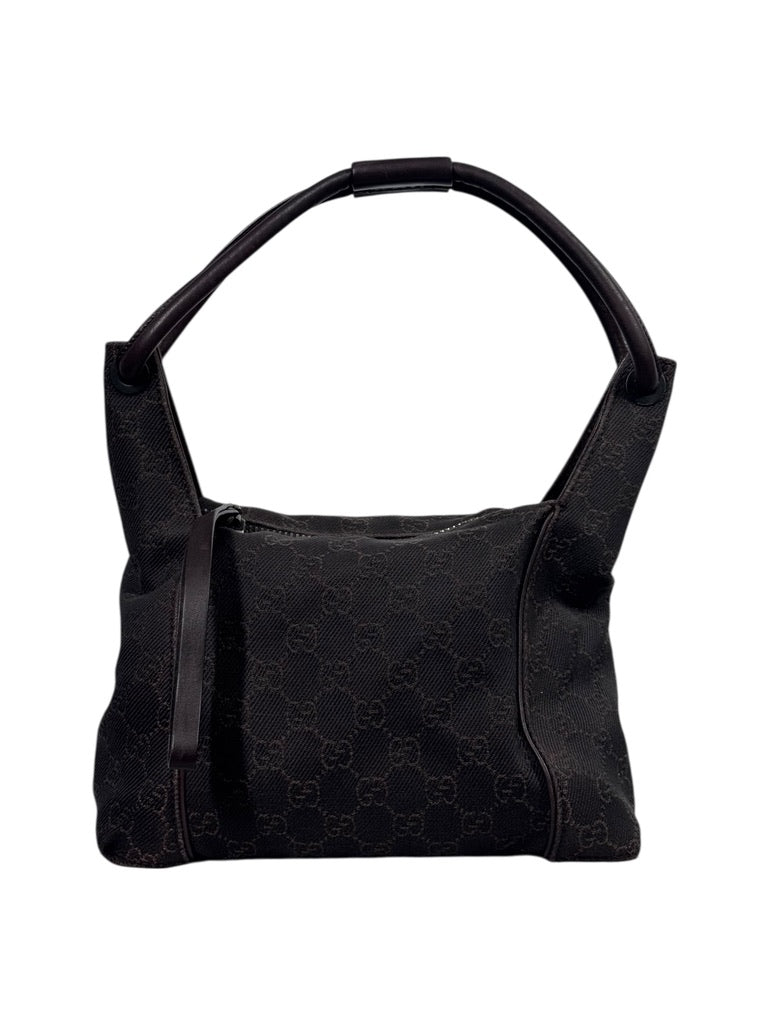 Browngucci canvashandbag with a pattern on a white background