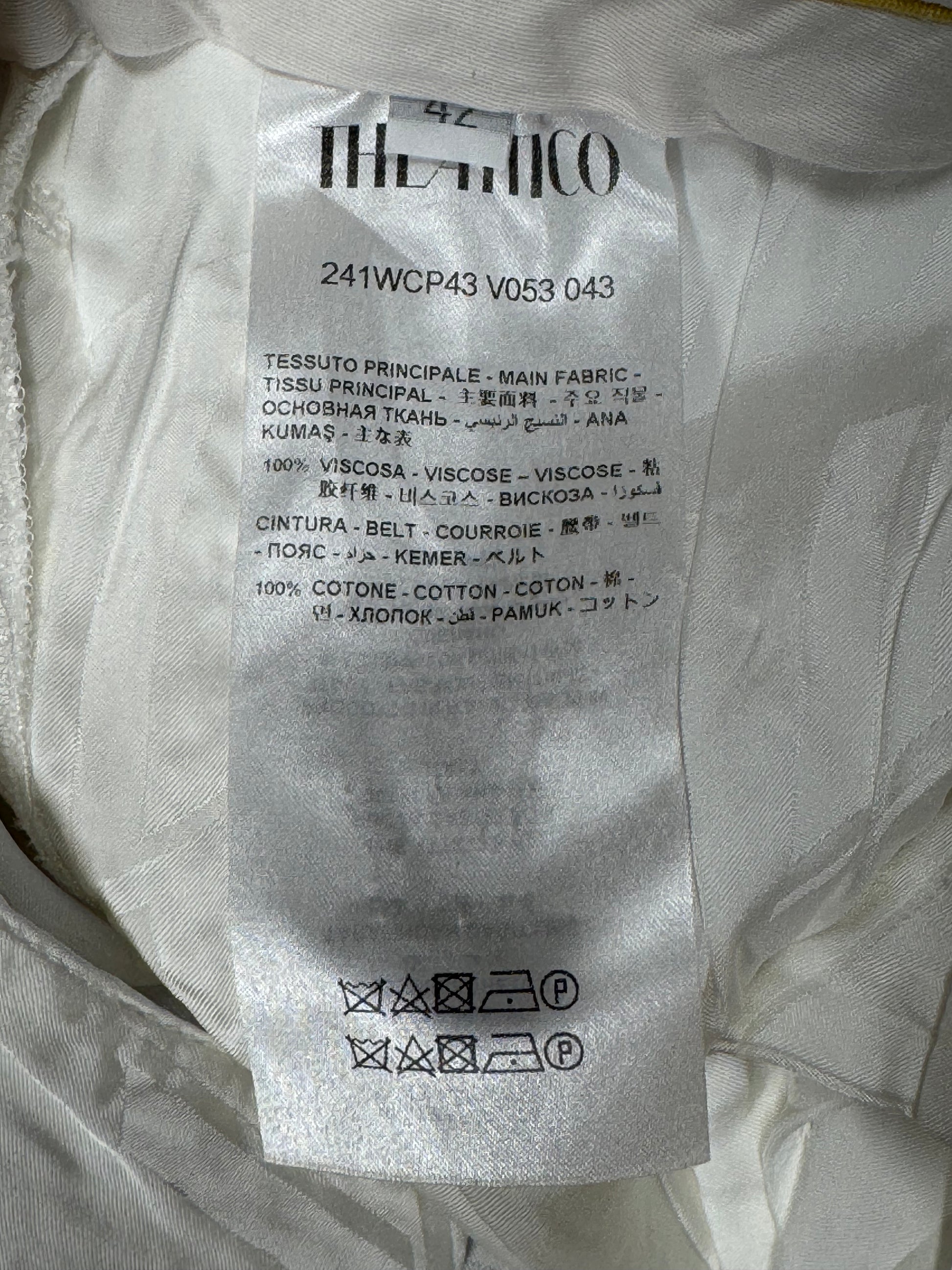 THE ATTICO CLOTHING LABEL ON WHITE PANTS