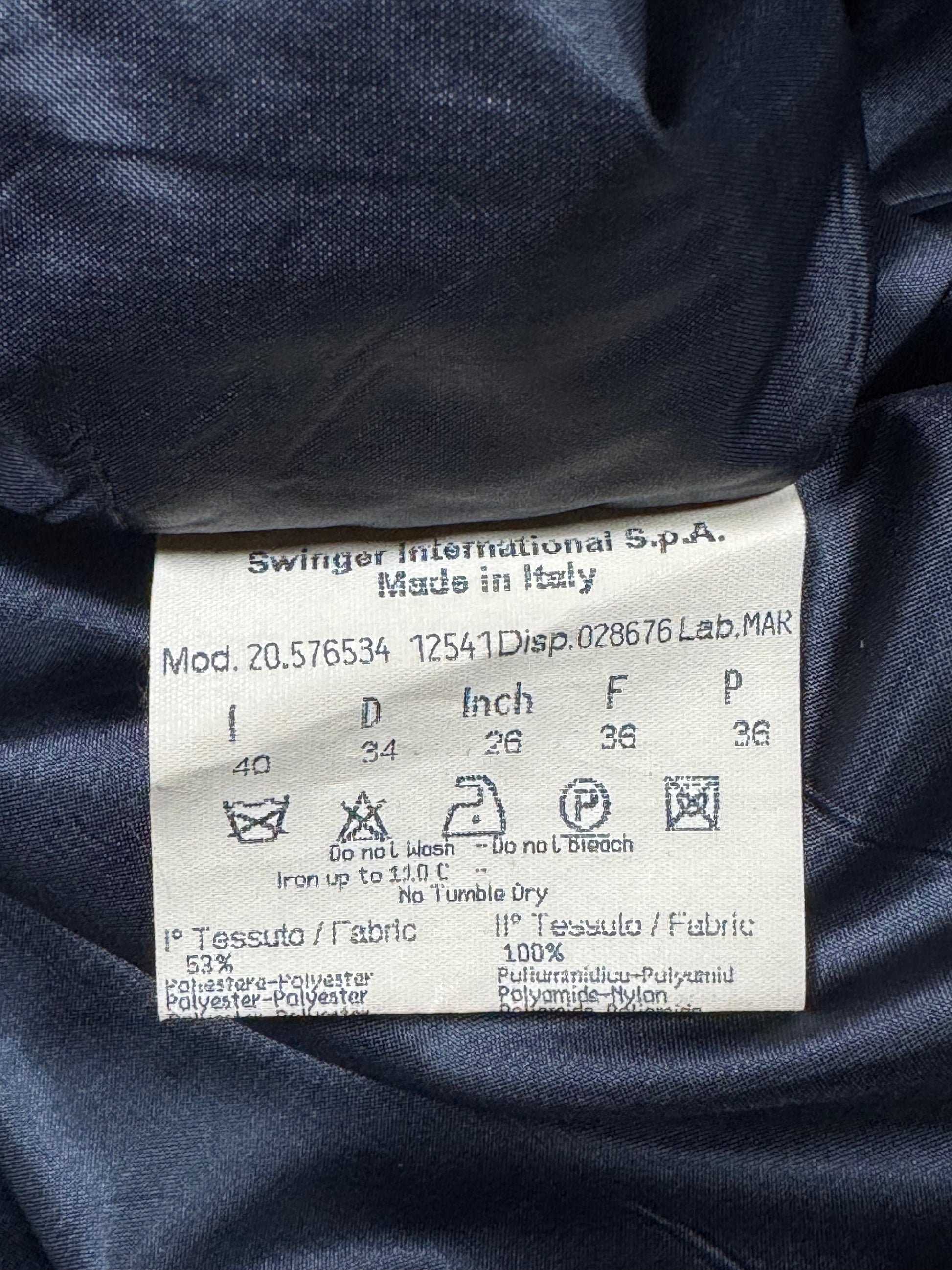 Clothing label on a navy fabric background