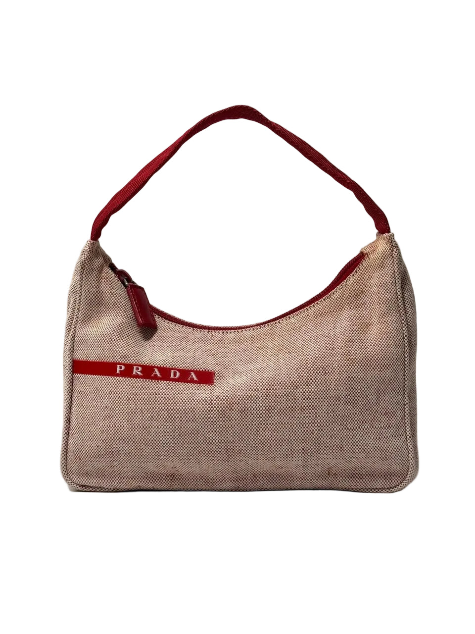 Red canvas handbag with red accents and Prada logo on a white background