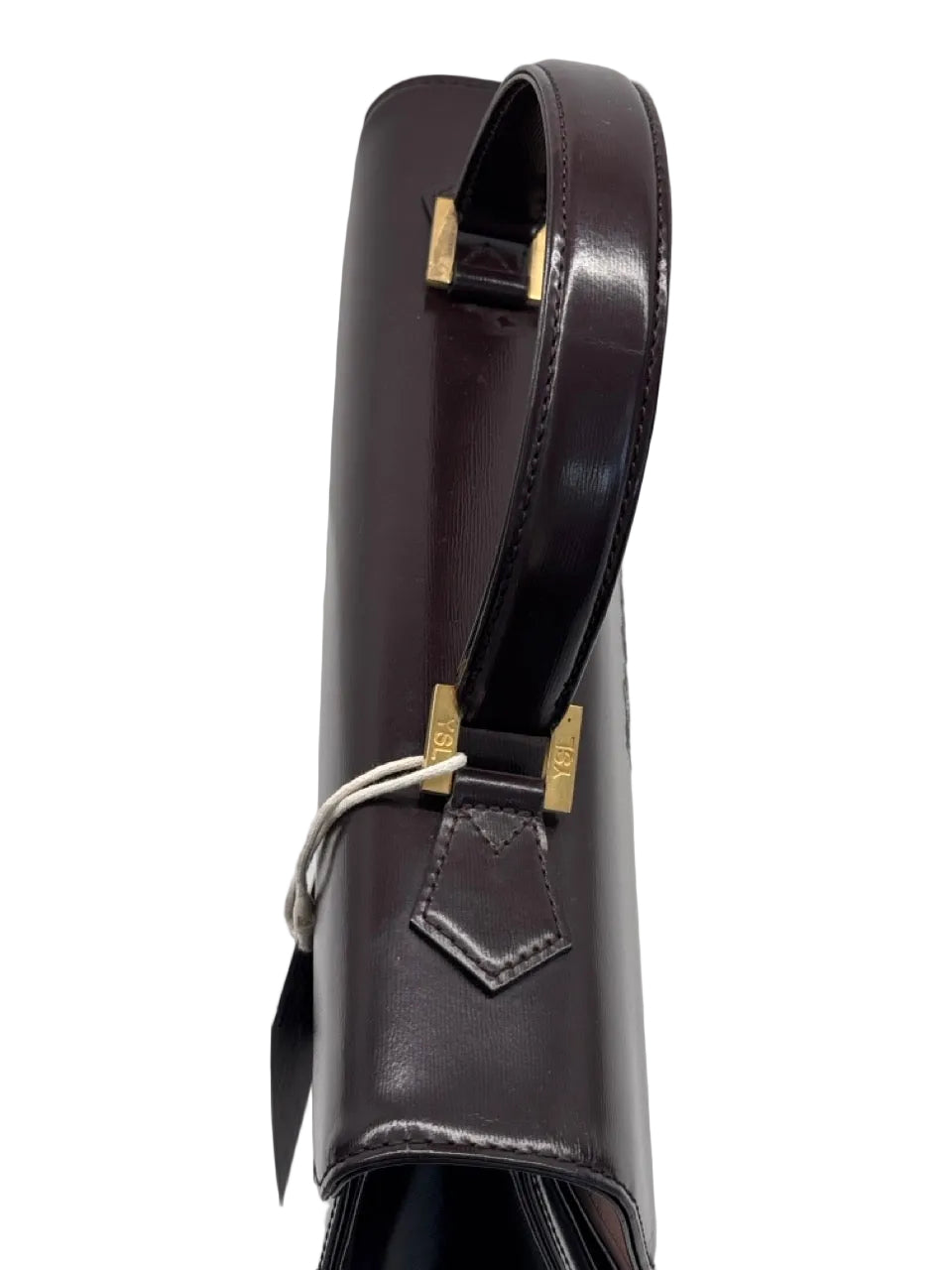 Dark brown leather bag with gold accents on a light gray background