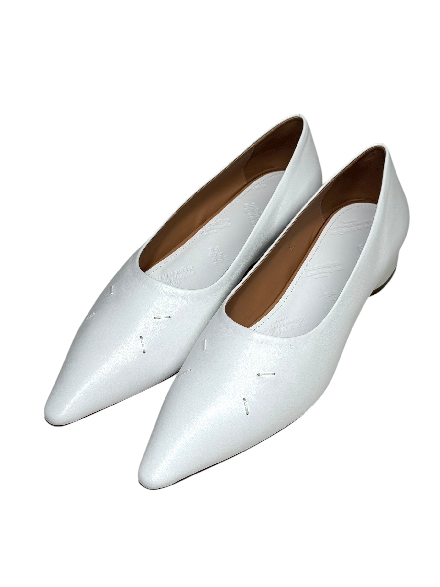 White leather flat margiela 4 stitch shoes on a white background