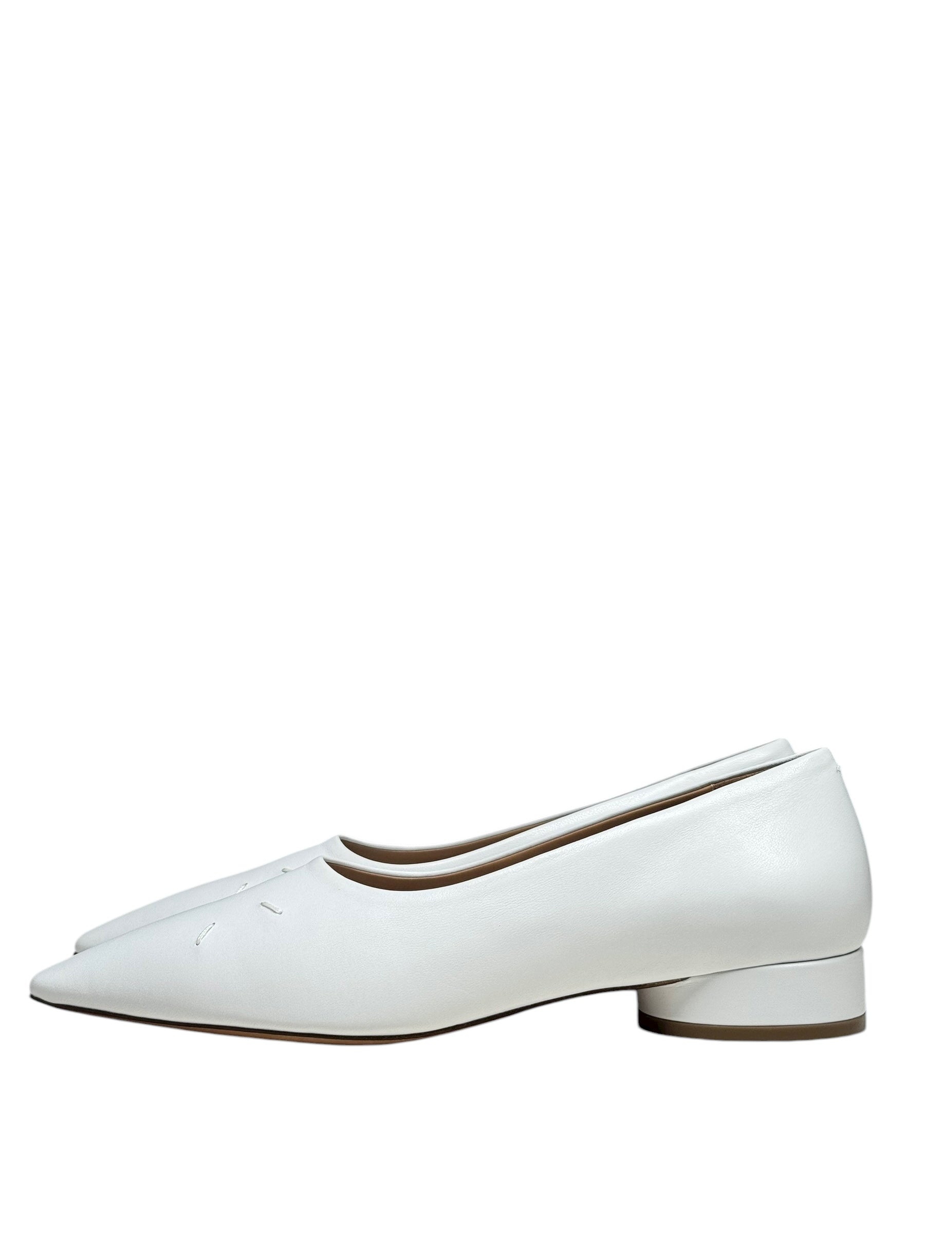White flat  margiela 4 stitch shoes on a white background