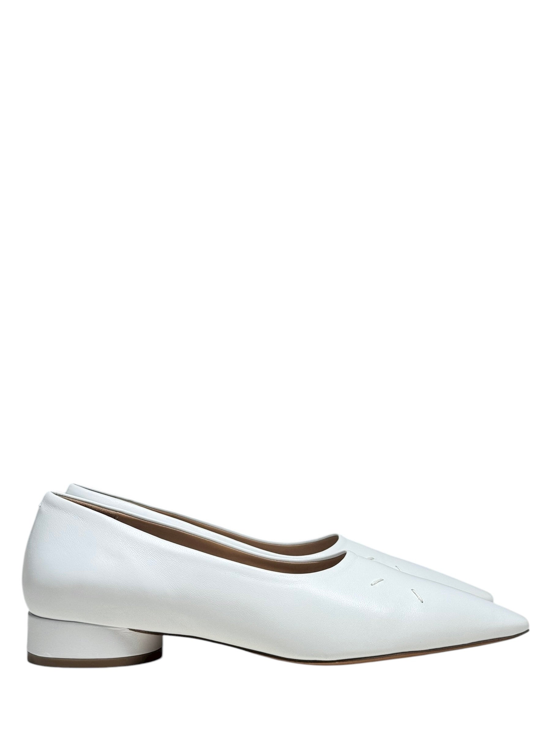 White leather flat margiela 4 stitch shoes on a white background