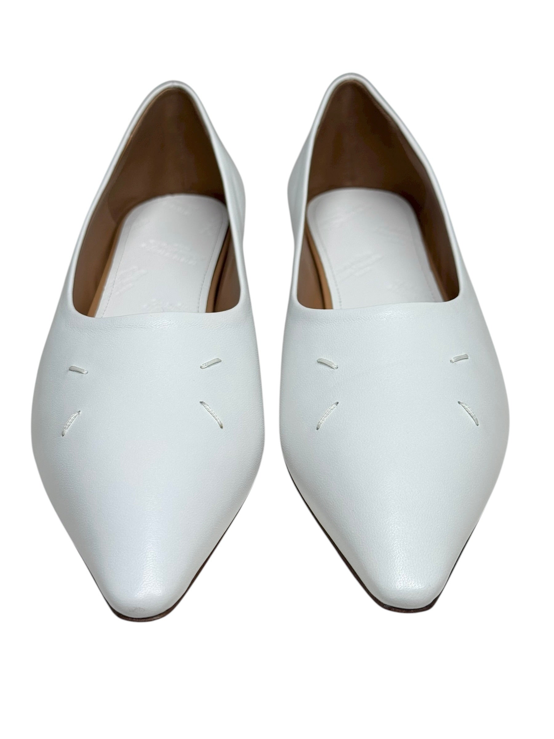 White leather flat margiela 4 stitch shoes on a white background