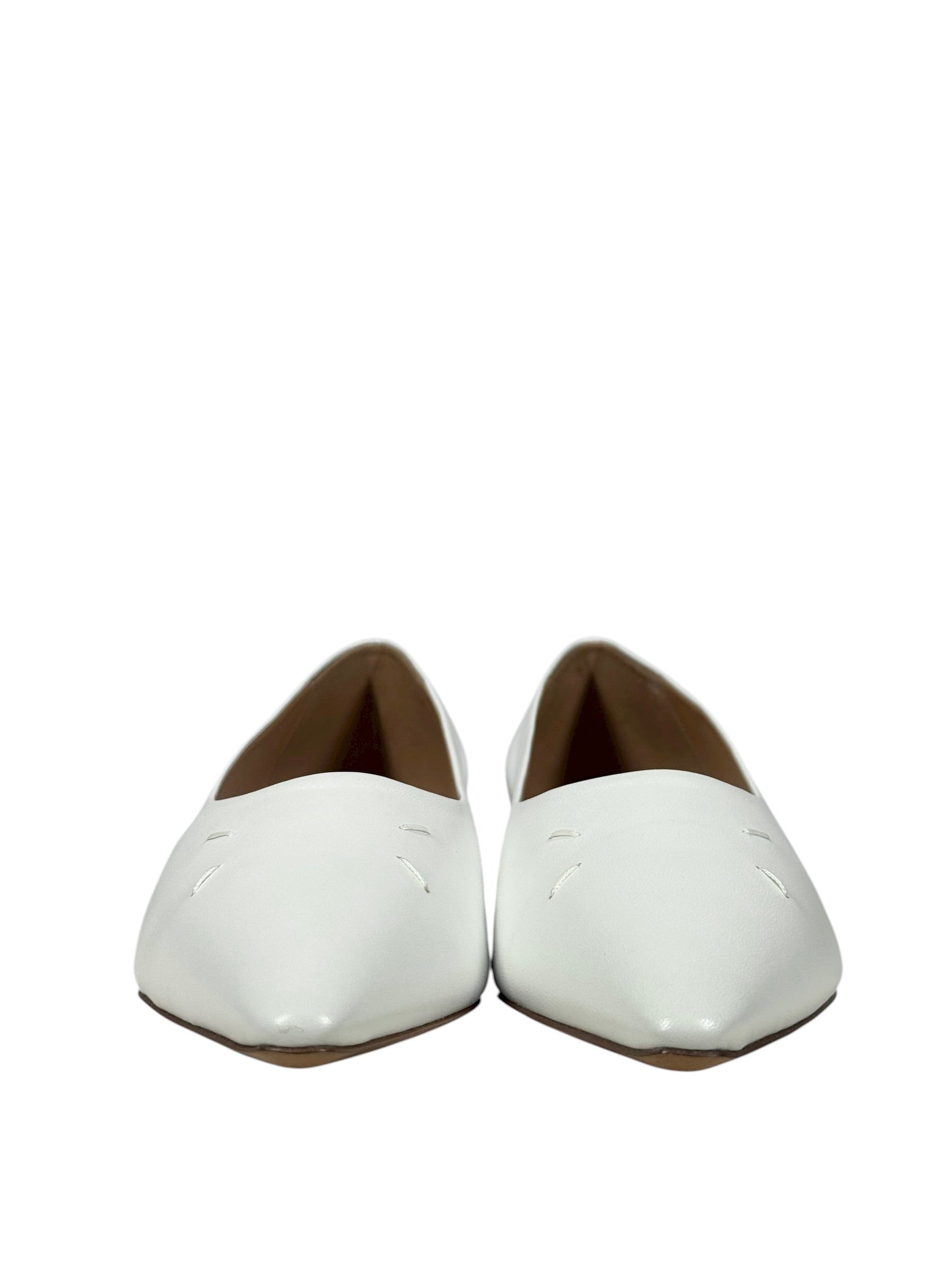 White leather flat margiela 4 stitch shoes on a white background
