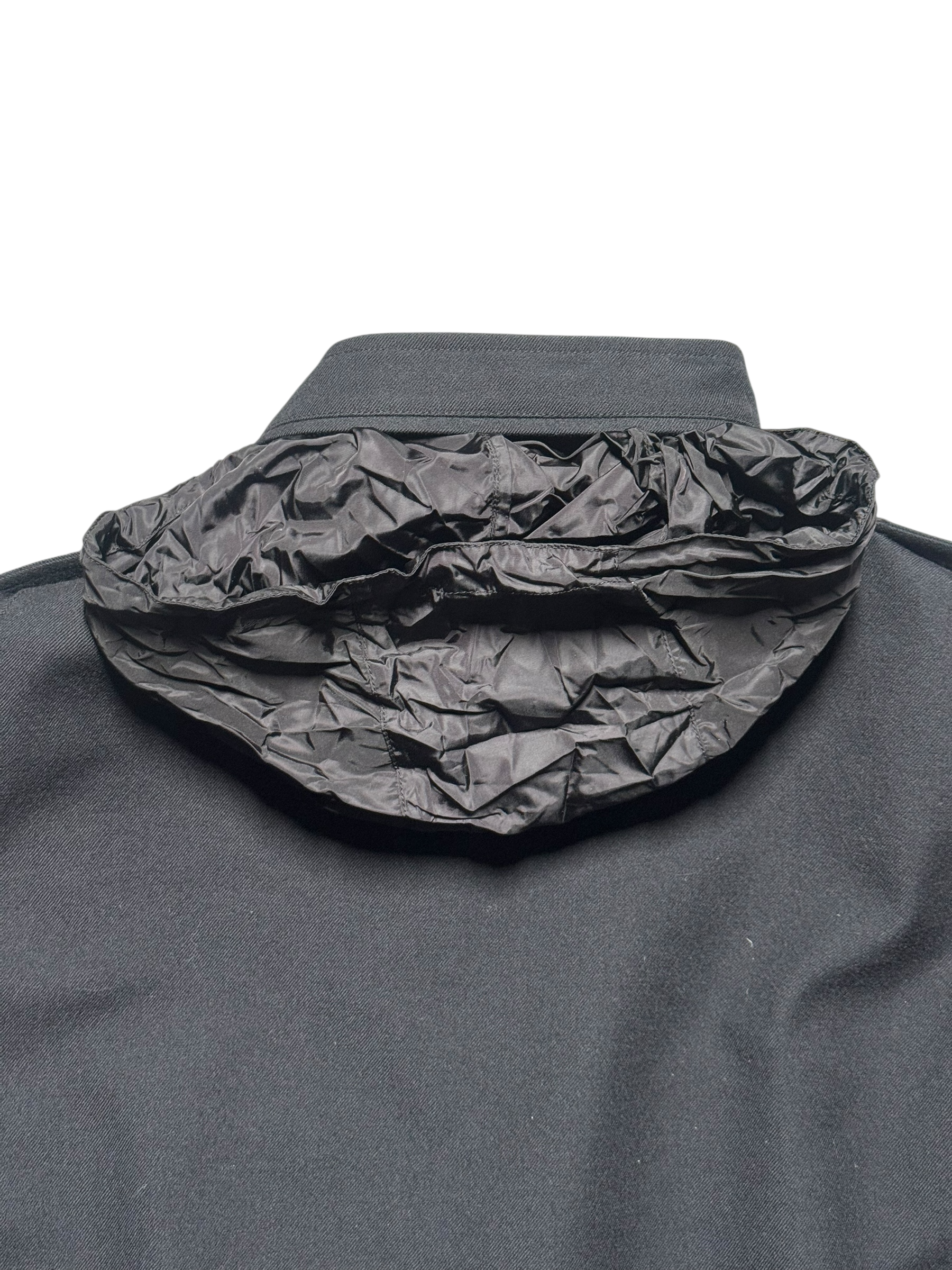 Dark gray jacket with a textured hood on a white background