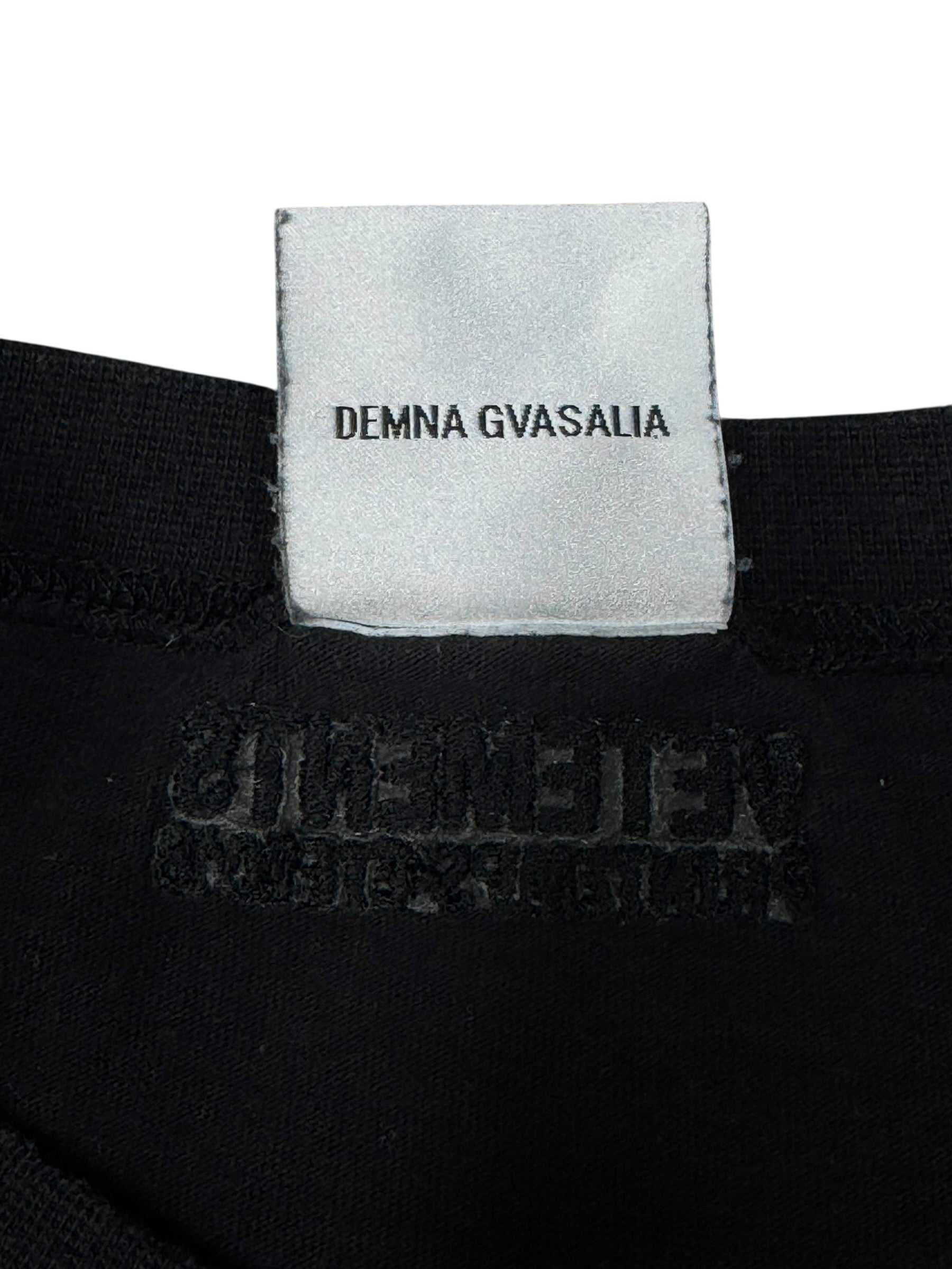 Black garment with a Demna Gvasalia label on a white background