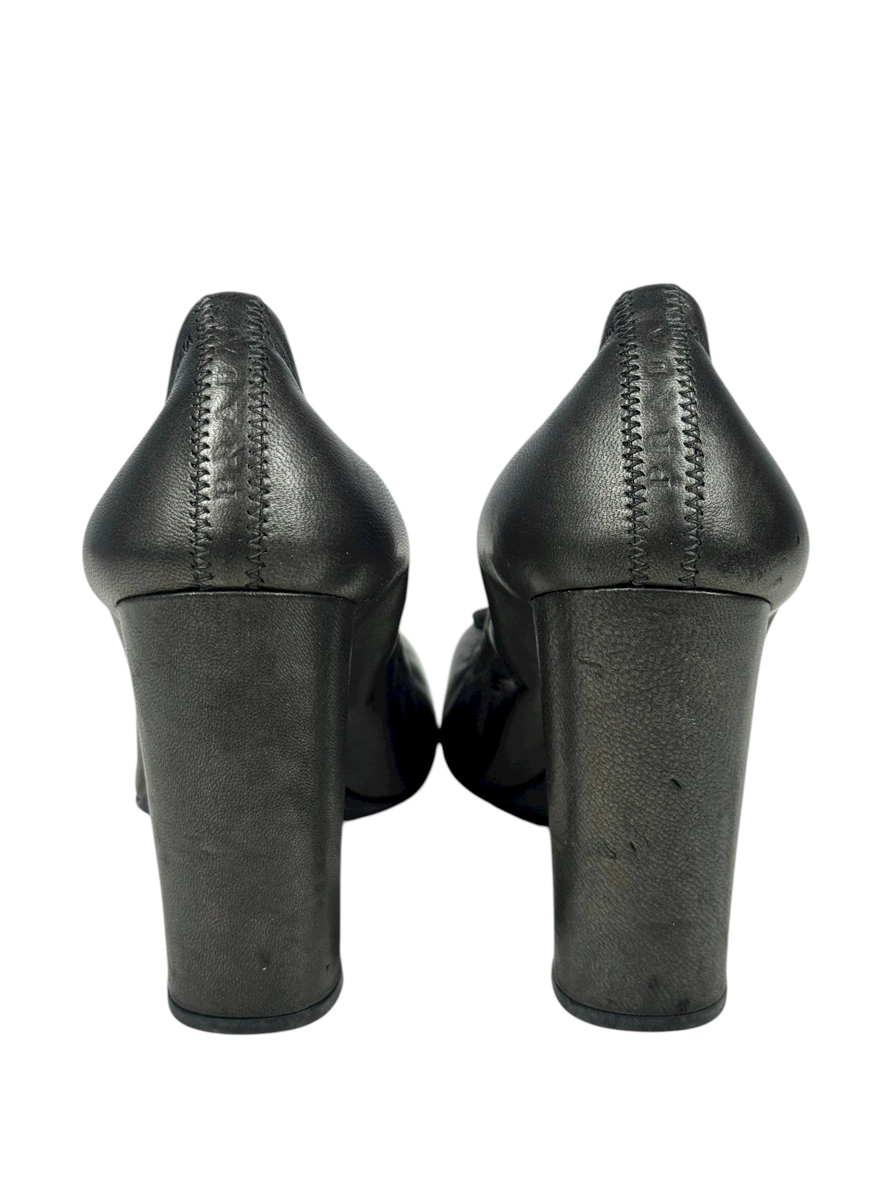 Black high-heeled shoes on a white background