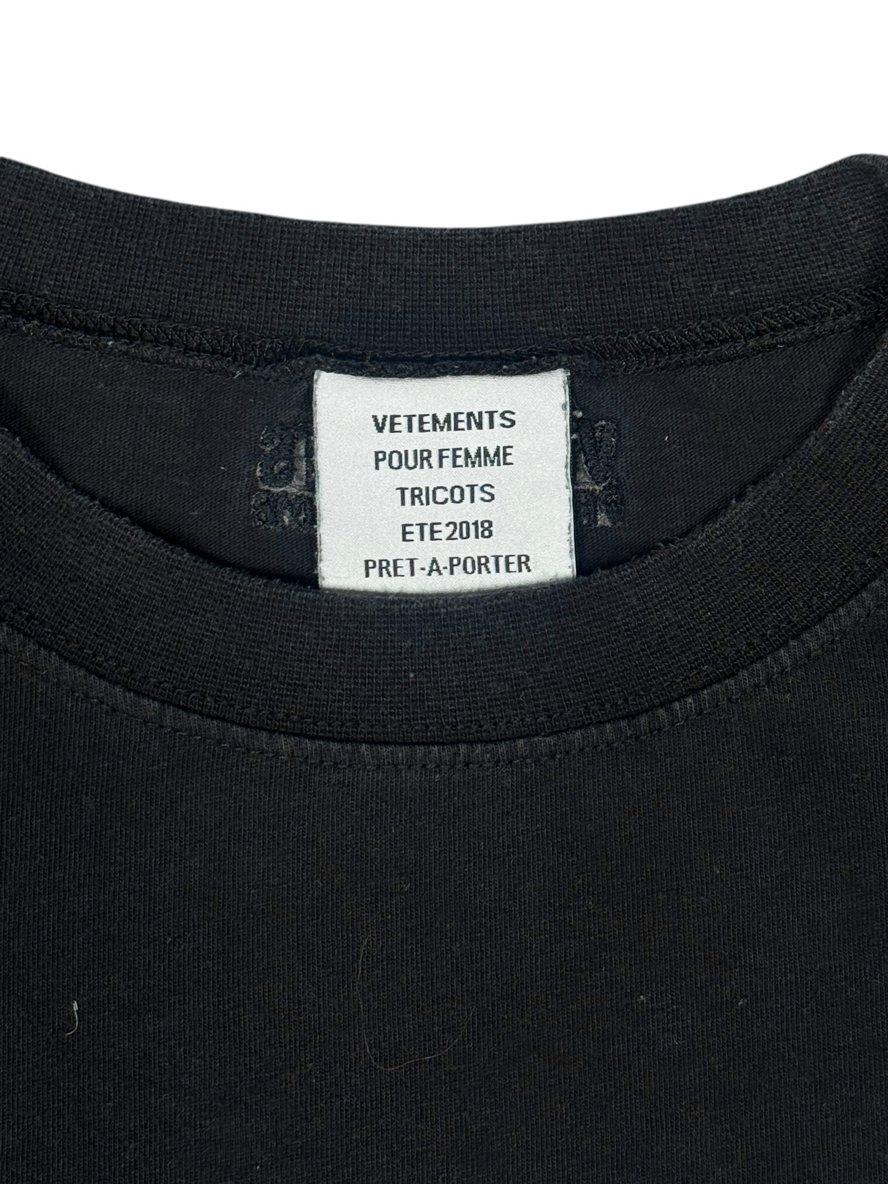 Black t-shirt with a visible brand label on a white background