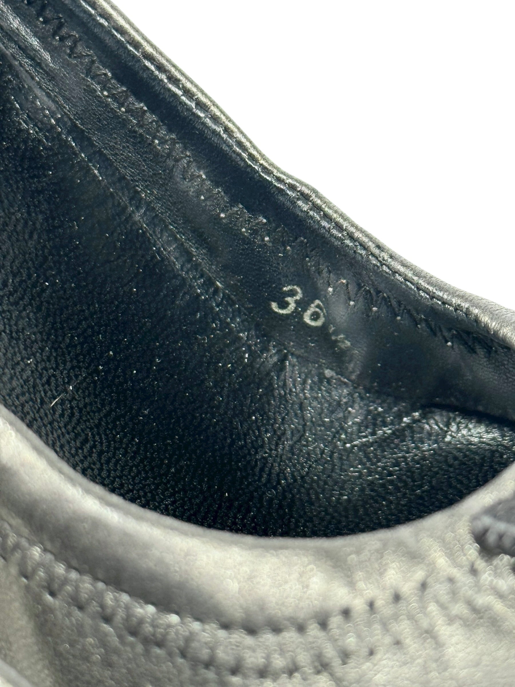 Close-up of a shoe with size '36' marking on the insole.