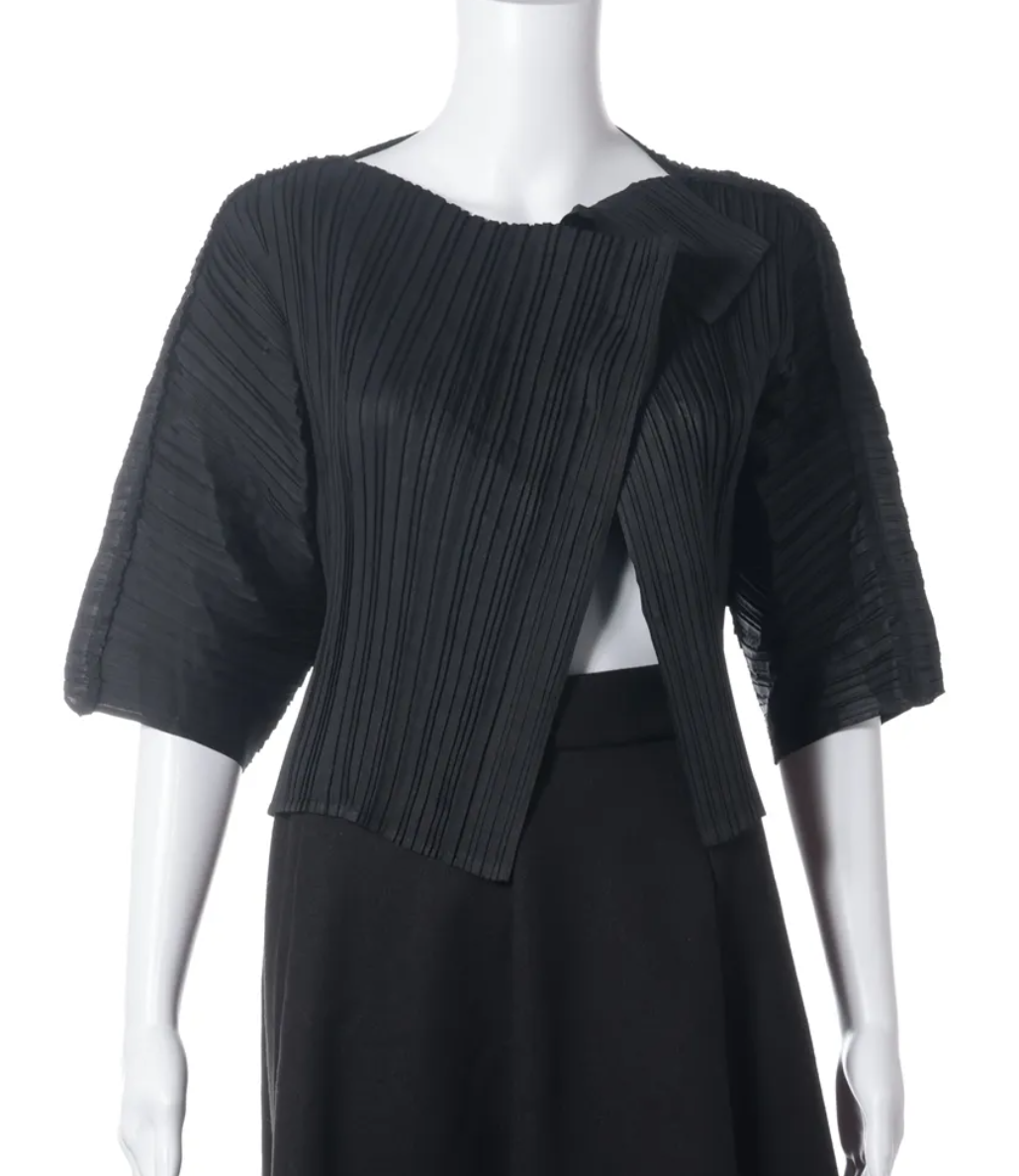 A black pleated short-sleeve wrap-style top displayed on a white mannequin against a plain white background.