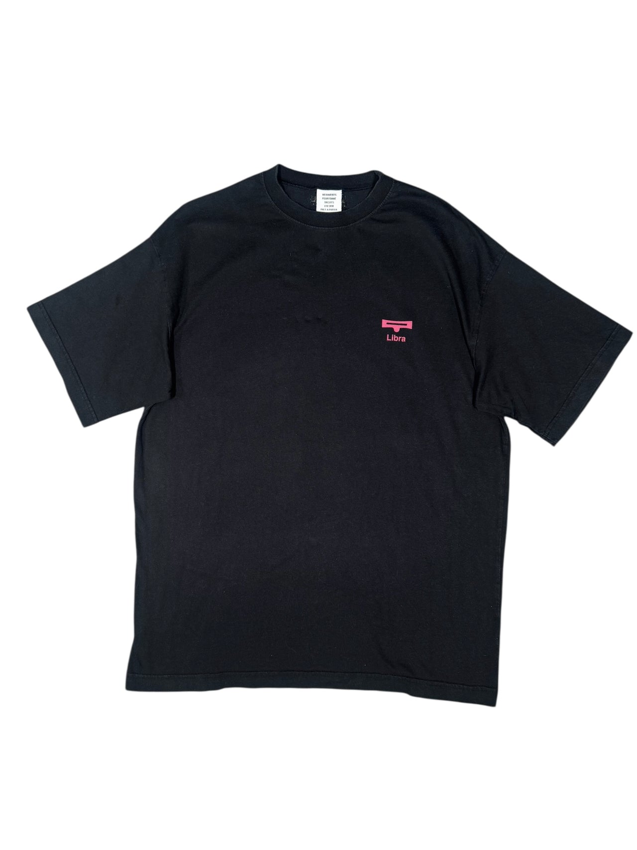 Black vintage "Vetements" t-shirt with a small pink logo on a white background